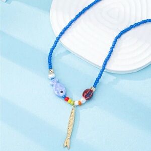 Anthropologie Blue Beaded Necklace with Gold Fish Charm